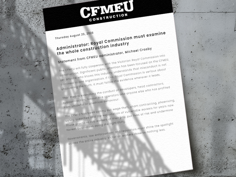 Letter-sized document on a concrete surface with a black CFMEU Construction header and bold headline about Royal Commission examining the construction industry (informational image).